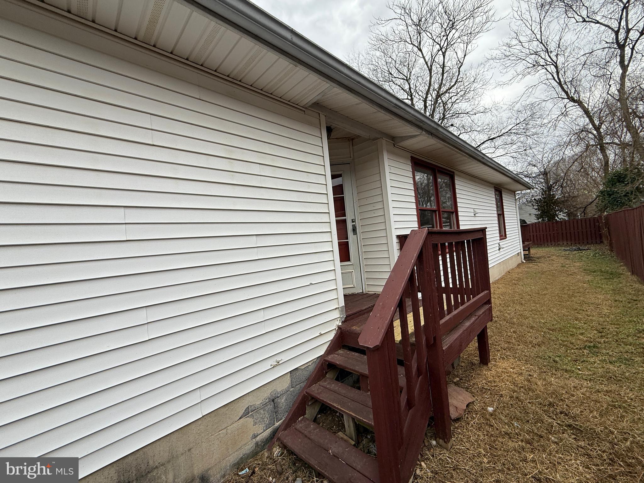 227 Bend Farm Road Fredericksburg, VA 22408 - Photo 2 of 22 a view of a house with a large window and wooden stairs