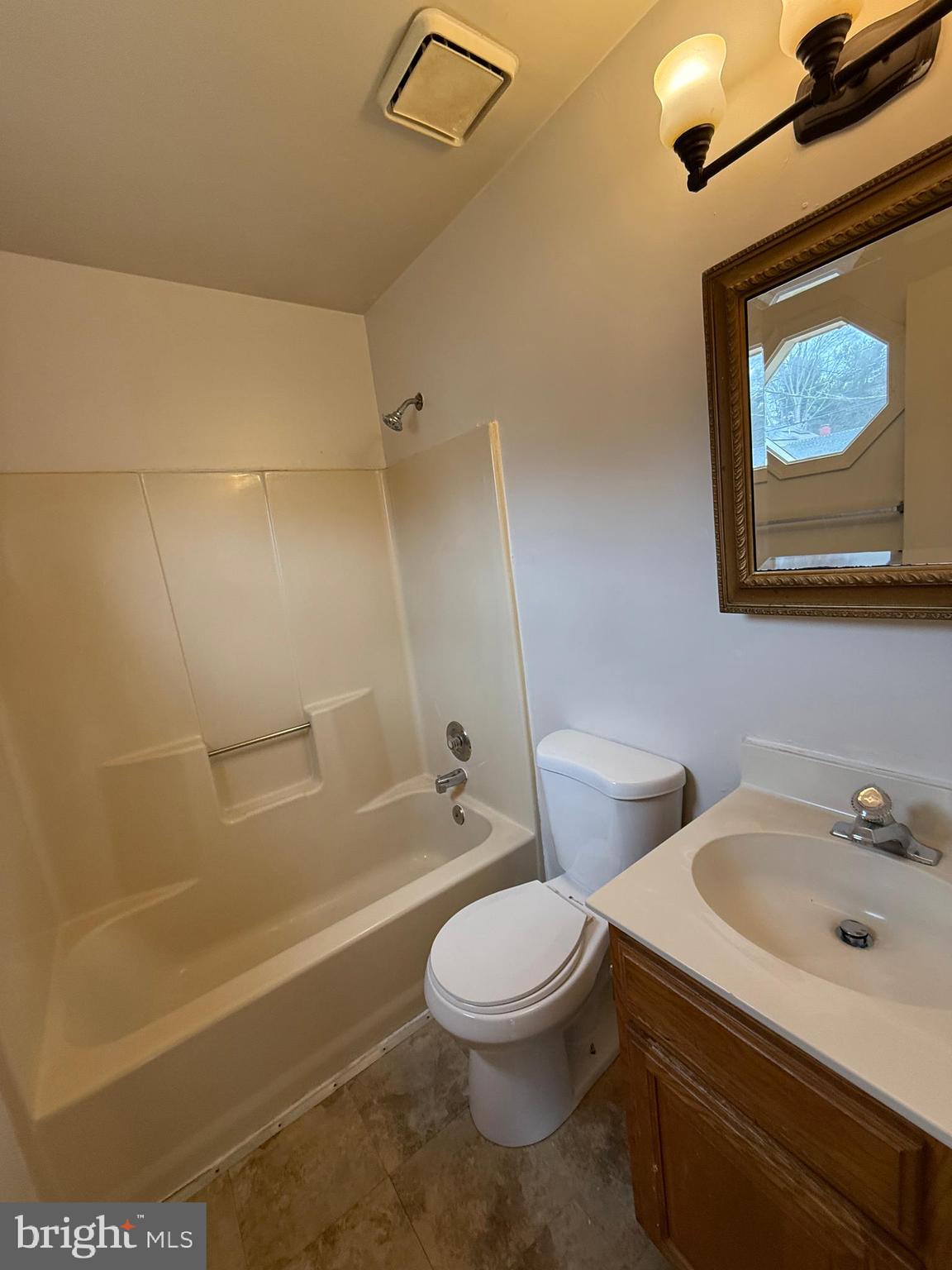 227 Bend Farm Road Fredericksburg, VA 22408 - Photo 22 of 22 a bathroom with a toilet a sink and bathtub