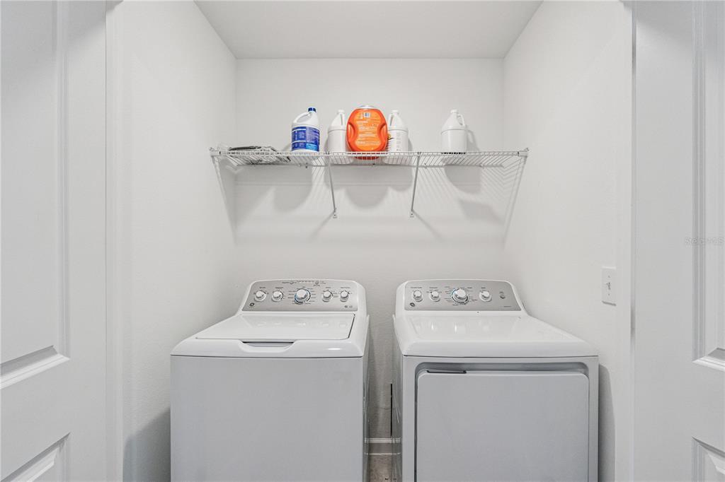 5931 Chestnut Grv Place St. Cloud, FL 34771 - Photo 18 of 20 a utility room with dryer and washer