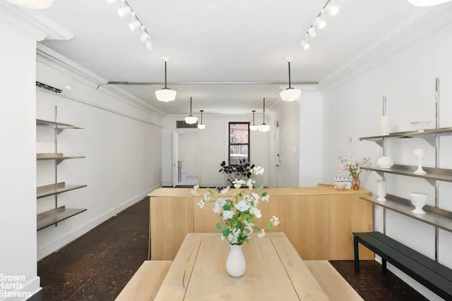 a large kitchen with stainless steel appliances kitchen island granite countertop a sink and cabinets
