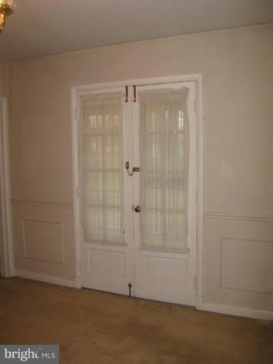 210 Charmuth Road Lutherville-Timonium, MD 21093 - Photo 7 of 21 French Doors from DR Open to Screened Porch