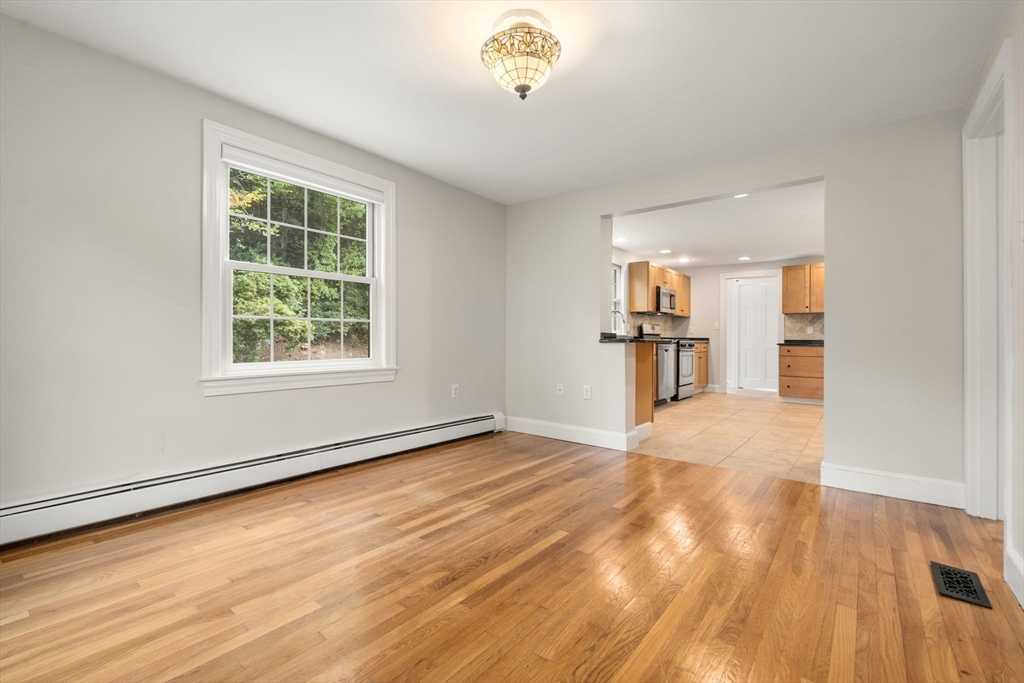 92 Abbot Street Andover, MA 01810 - Photo 18 of 35 wooden floor in an empty room with a window