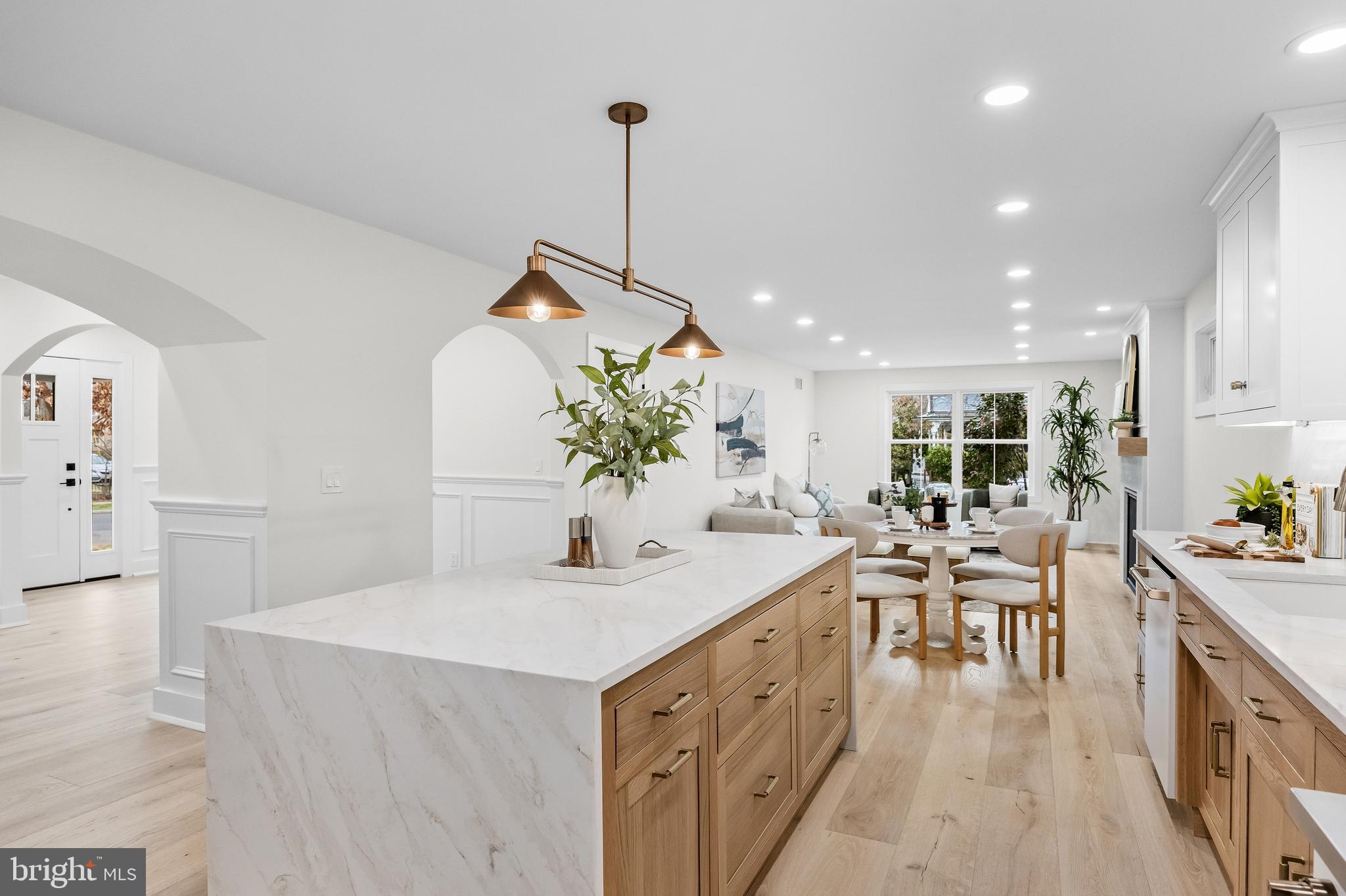 201 Centre Street Haddonfield, NJ 08033 - Photo 12 of 48 a room with stainless steel appliances kitchen island a table and chairs in it