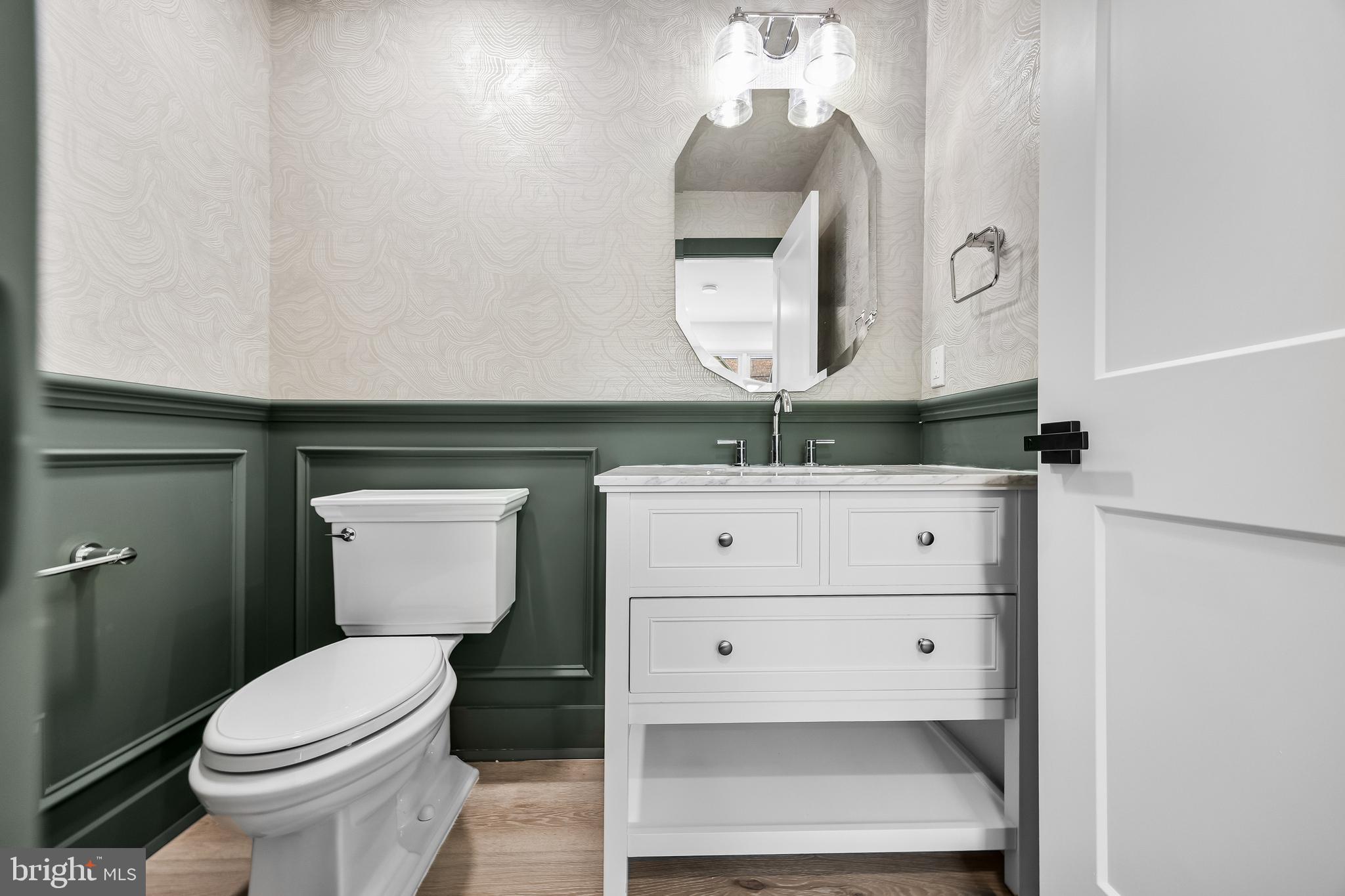 201 Centre Street Haddonfield, NJ 08033 - Photo 22 of 48 a bathroom with a toilet sink and mirror