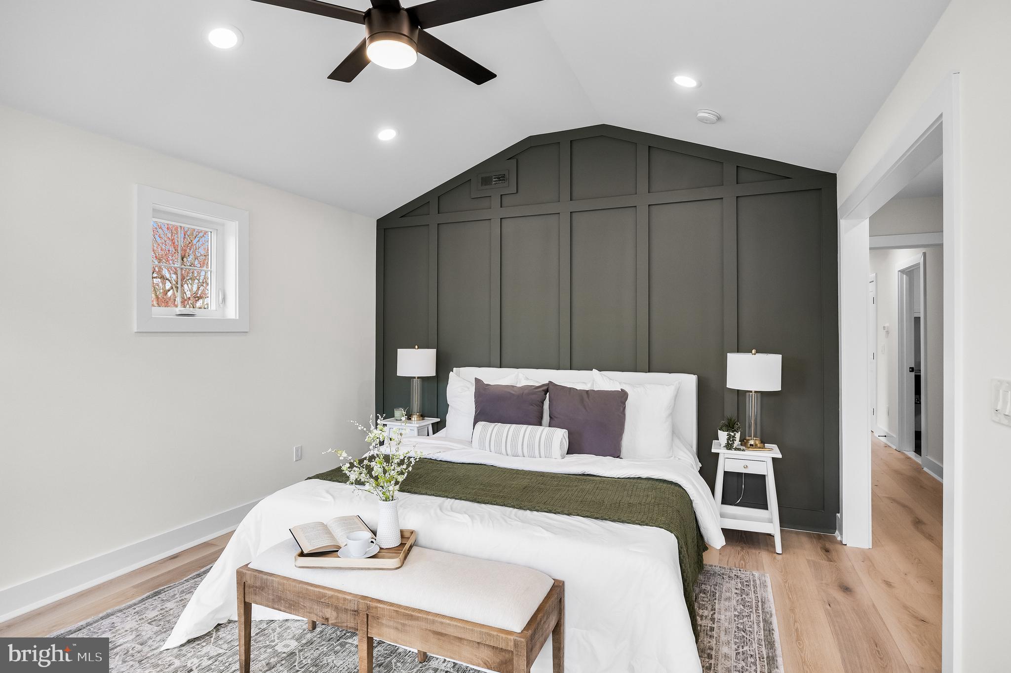 201 Centre Street Haddonfield, NJ 08033 - Photo 24 of 48 a bedroom with a bed and a chandelier