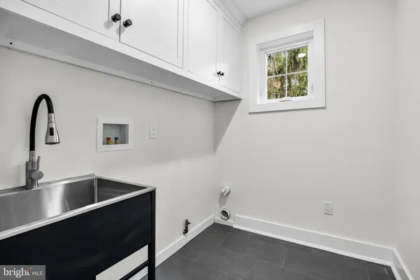 a view of storage and utility room with window