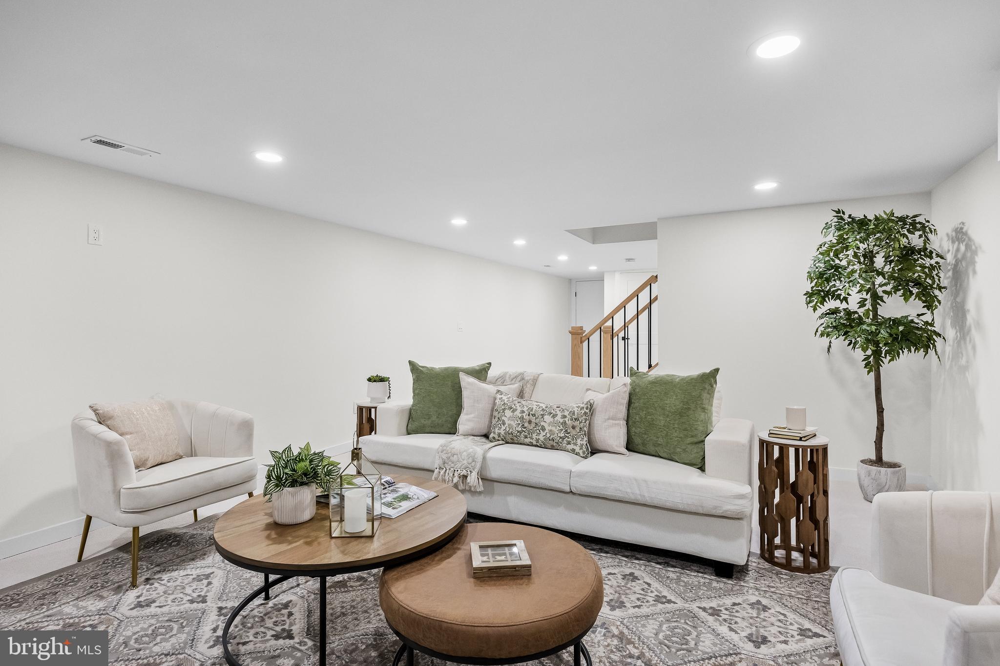 201 Centre Street Haddonfield, NJ 08033 - Photo 37 of 48 a living room with furniture and a potted plant