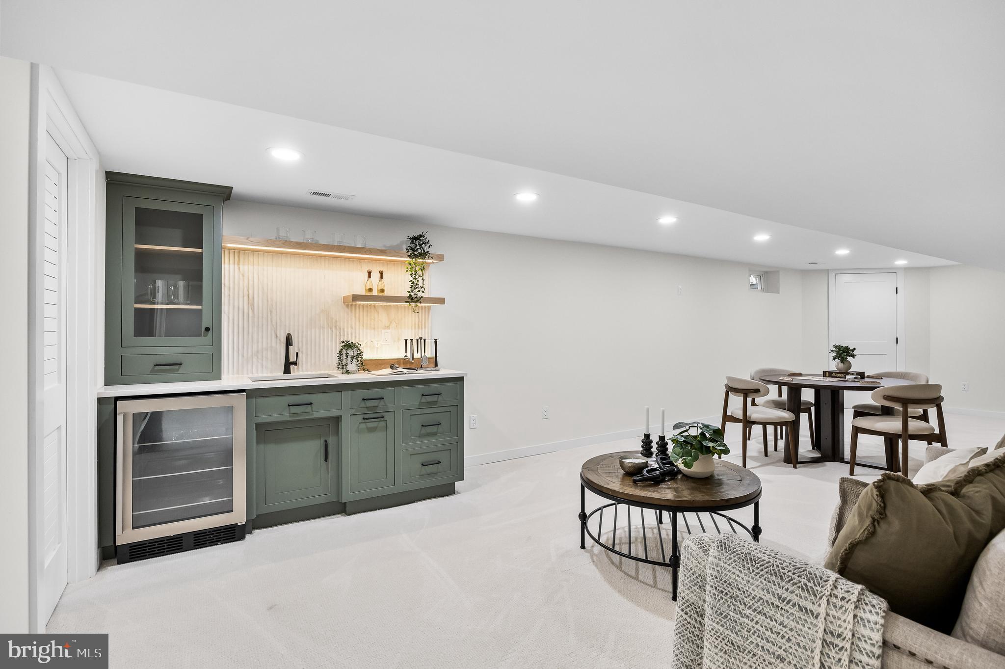 201 Centre Street Haddonfield, NJ 08033 - Photo 38 of 48 a kitchen with stainless steel appliances kitchen island granite countertop a sink and a refrigerator