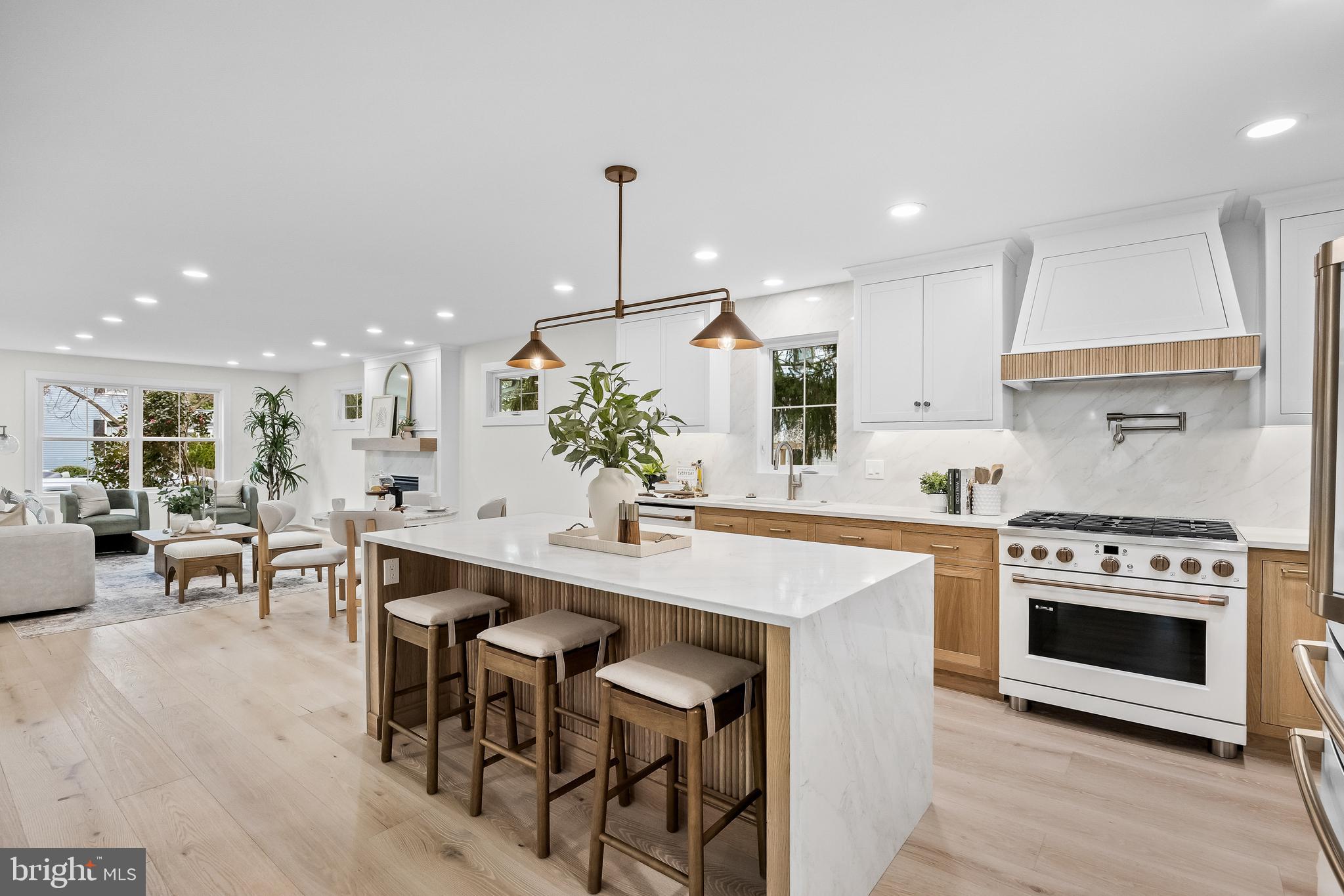 201 Centre Street Haddonfield, NJ 08033 - Photo 4 of 48 a kitchen with stainless steel appliances a stove a sink a oven a table and chairs