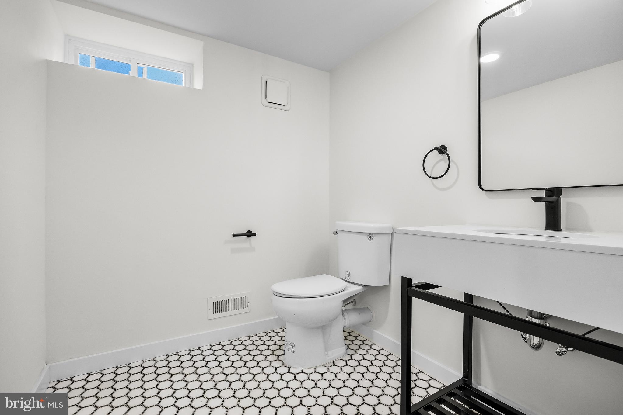 201 Centre Street Haddonfield, NJ 08033 - Photo 41 of 48 a bathroom with a toilet and a sink