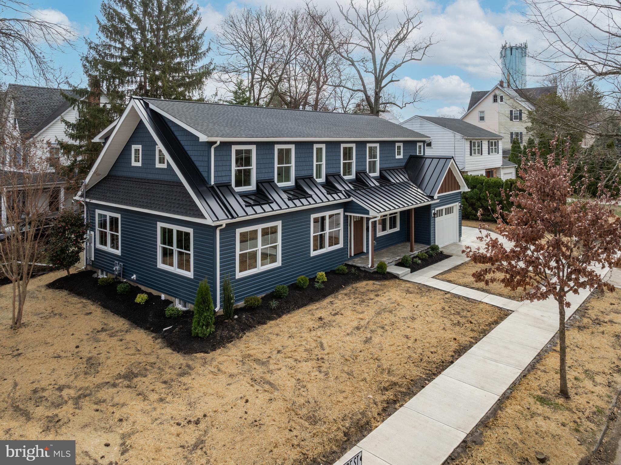 201 Centre Street Haddonfield, NJ 08033 - Photo 42 of 48 a front view of a house with yard covered in snow