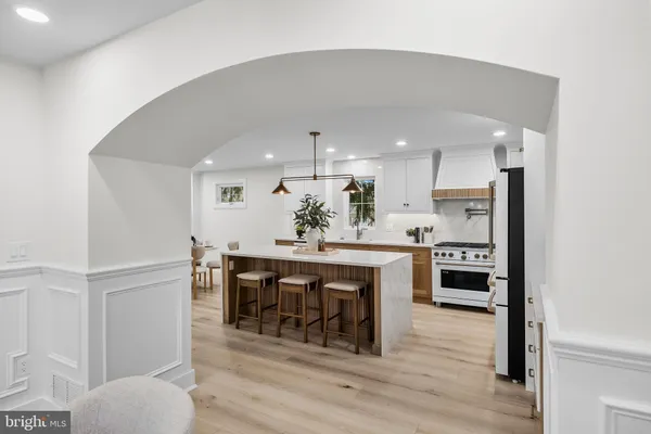 a kitchen with a table and chairs in it