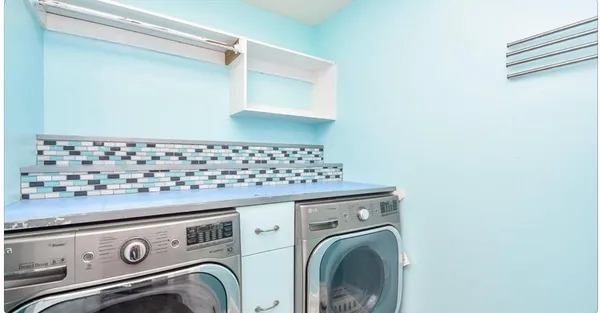 a close view of utility room with washer and dryer