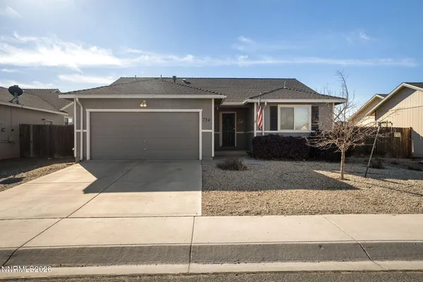 a front view of a house with garage