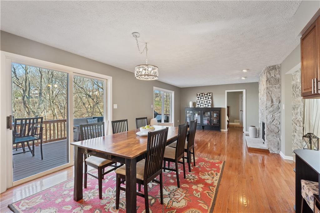 271 Shafer Road Coraopolis, PA 15108 - Photo 12 of 50 The dining area, with its open and airy design, creates a seamless flow, making it an ideal space for entertaining guests, or simply enjoying everyday meals in a serene setting.
