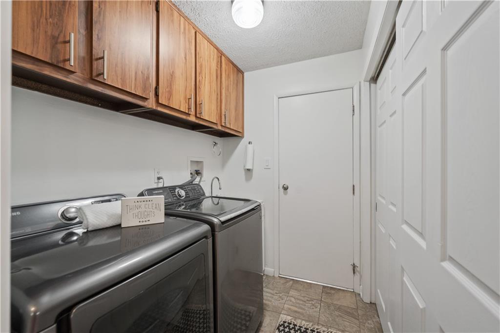 271 Shafer Road Coraopolis, PA 15108 - Photo 19 of 50 The first-floor laundry, just off the kitchen, adds ease and efficiency to daily routines, making household chores a breeze.