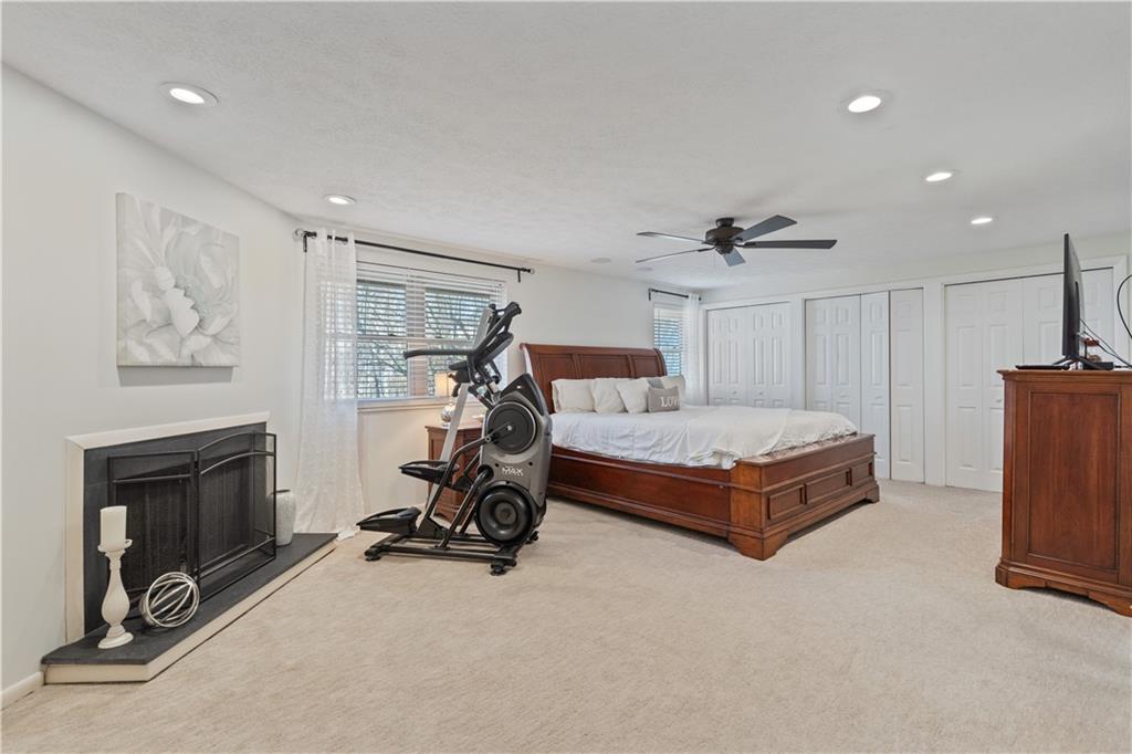 271 Shafer Road Coraopolis, PA 15108 - Photo 21 of 50 The expansive master en-suite is a true retreat, featuring recessed lighting, fresh paint and a cozy wood burning fireplace, creating a warm and inviting ambiance.