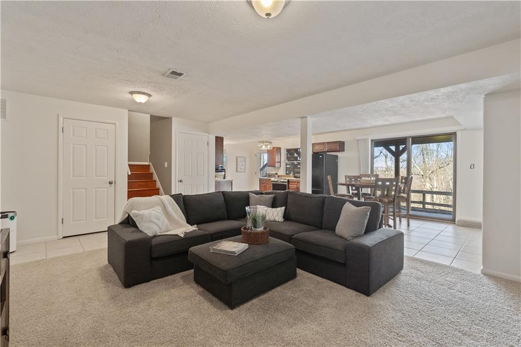 271 Shafer Road Coraopolis, PA 15108 - Photo 28 of 50 The expansive lower level offers endless possibilities. Fresh paint, new lighting, this versatile space can be tailored to suit your needs, whether for extended family, entertaining, or creating a retreat all your own.