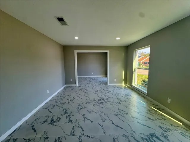 a view of an empty room and window