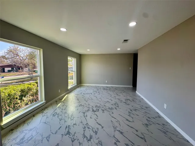 a view of an empty room and window