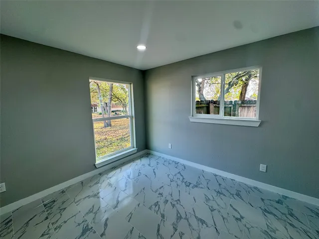 an empty room with windows