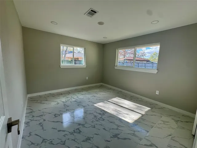 a view of empty room with windows