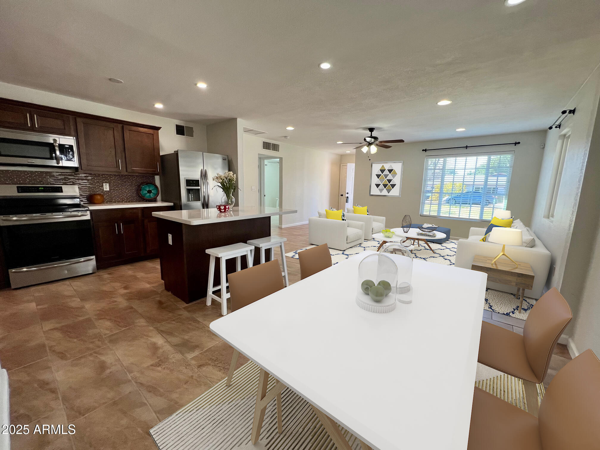 6711 North 14th Place Phoenix, AZ 85014 - Photo 3 of 27 a kitchen with stainless steel appliances granite countertop a sink a stove and a refrigerator