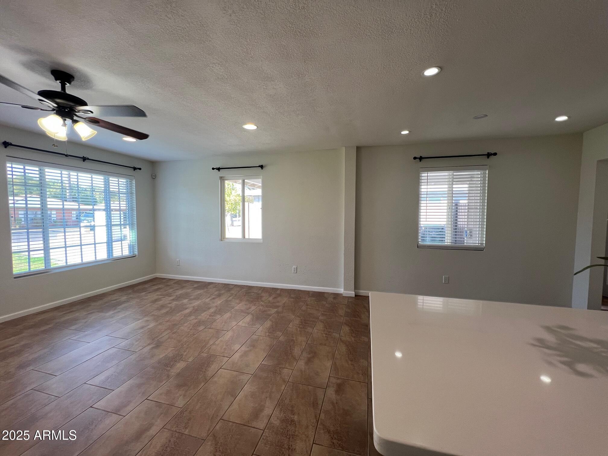 6711 North 14th Place Phoenix, AZ 85014 - Photo 7 of 27 a view of an empty room with a window