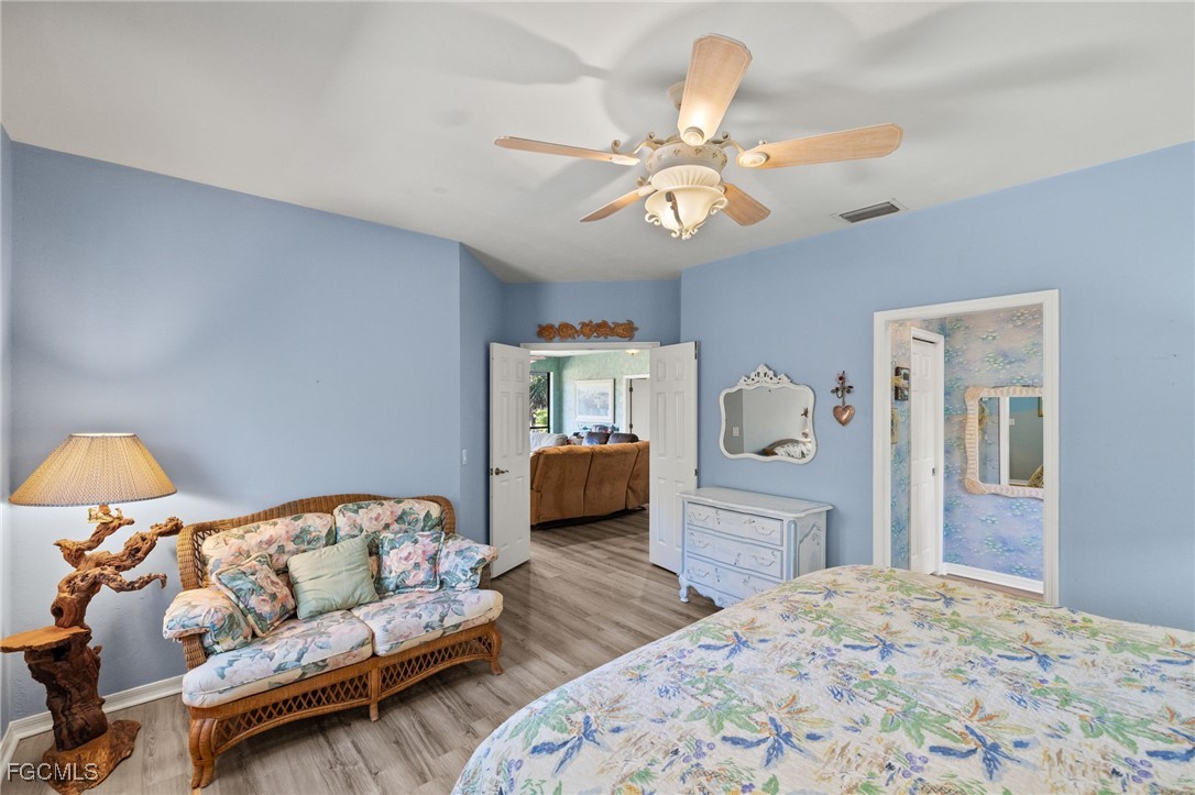 4631 Bowen Bayou Road Sanibel, FL 33957 - Photo 17 of 39 a bedroom with furniture and wooden floor