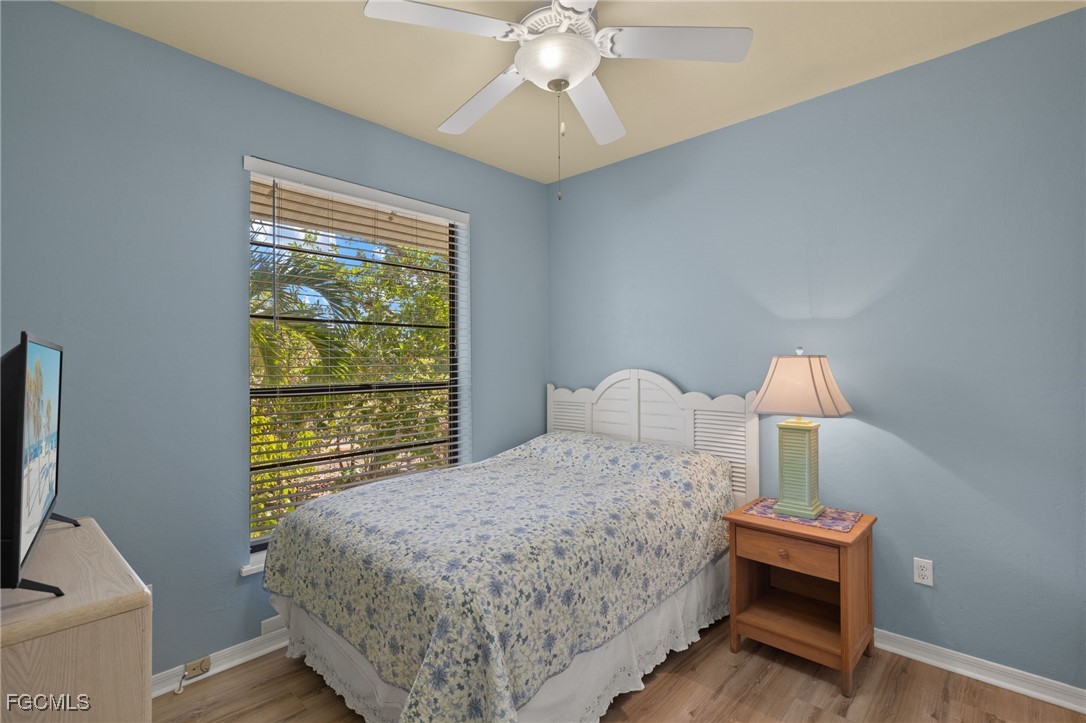 4631 Bowen Bayou Road Sanibel, FL 33957 - Photo 20 of 39 a bedroom with a bed and a window