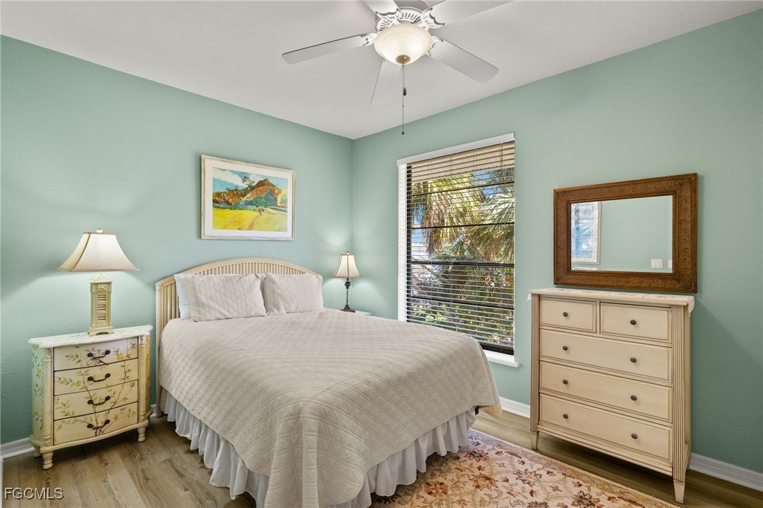 4631 Bowen Bayou Road Sanibel, FL 33957 - Photo 24 of 39 a bedroom with a bed and a dresser