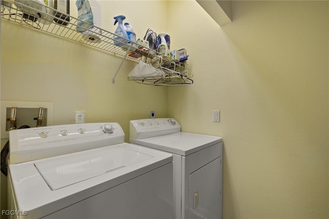 4631 Bowen Bayou Road Sanibel, FL 33957 - Photo 25 of 39 a utility room with dryer and washer