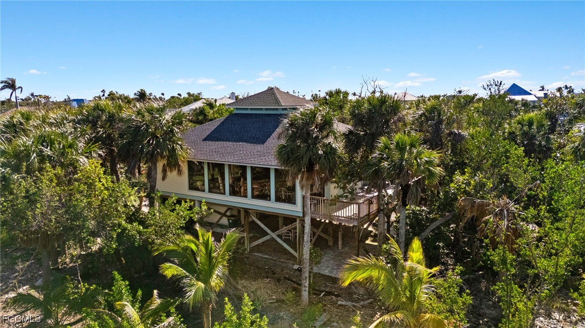 4631 Bowen Bayou Road Sanibel, FL 33957 - Photo 31 of 39 a view of a house with a yard