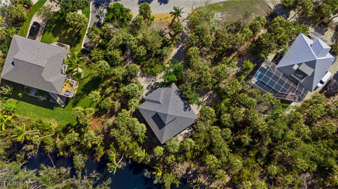 4631 Bowen Bayou Road Sanibel, FL 33957 - Photo 32 of 39 an aerial view of a house with a yard and garden