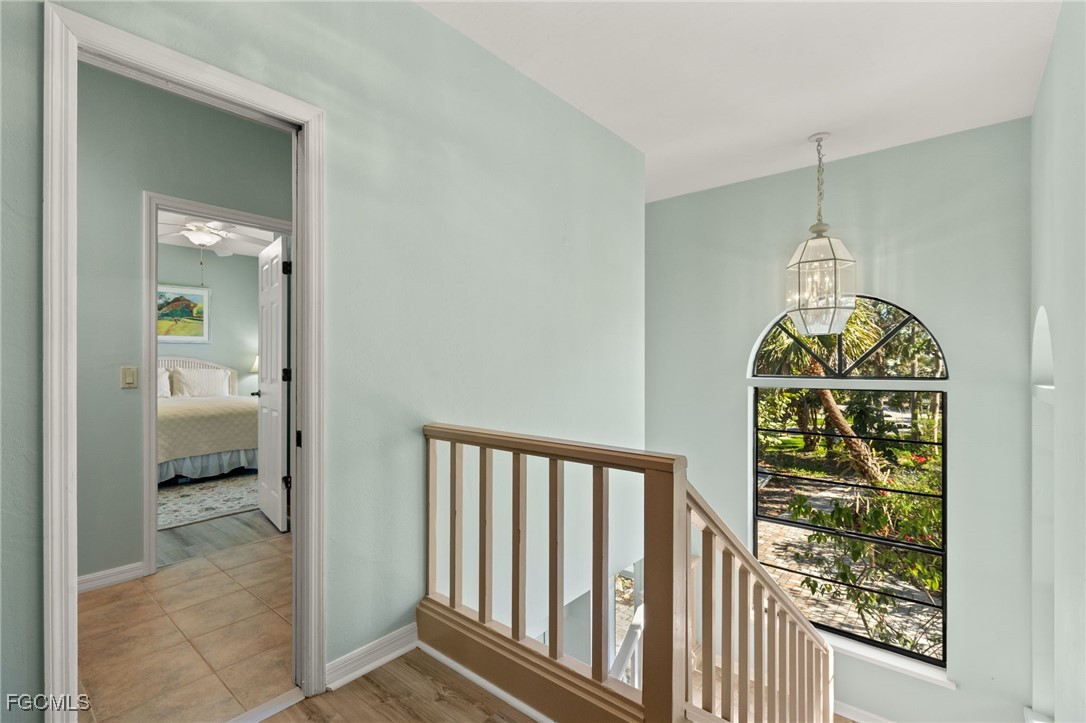 4631 Bowen Bayou Road Sanibel, FL 33957 - Photo 6 of 39 a view of a hallway to a livingroom and a dining room with furniture