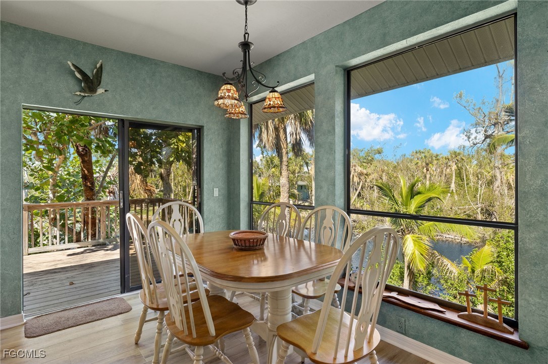 4631 Bowen Bayou Road Sanibel, FL 33957 - Photo 10 of 39 a view of a dining room with furniture window and outside view