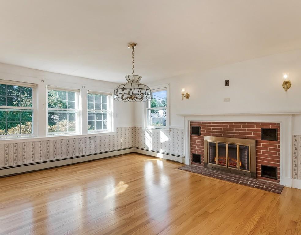 17 Nashoba Road Acton, MA 01720 - Photo 12 of 26 a view of an empty room with wooden floor and a window