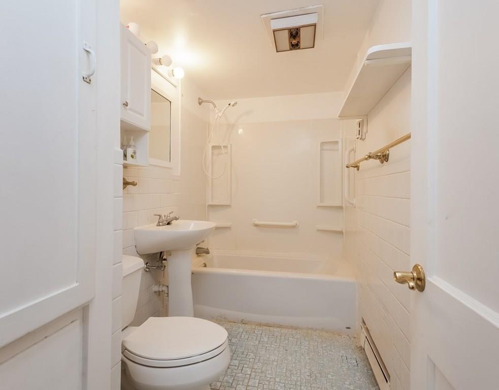17 Nashoba Road Acton, MA 01720 - Photo 23 of 26 a bathroom with a sink a toilet and shower