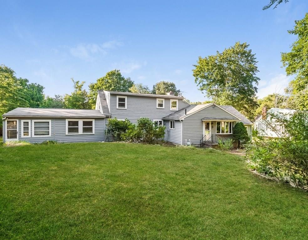 17 Nashoba Road Acton, MA 01720 - Photo 24 of 26 a front view of a house with a garden