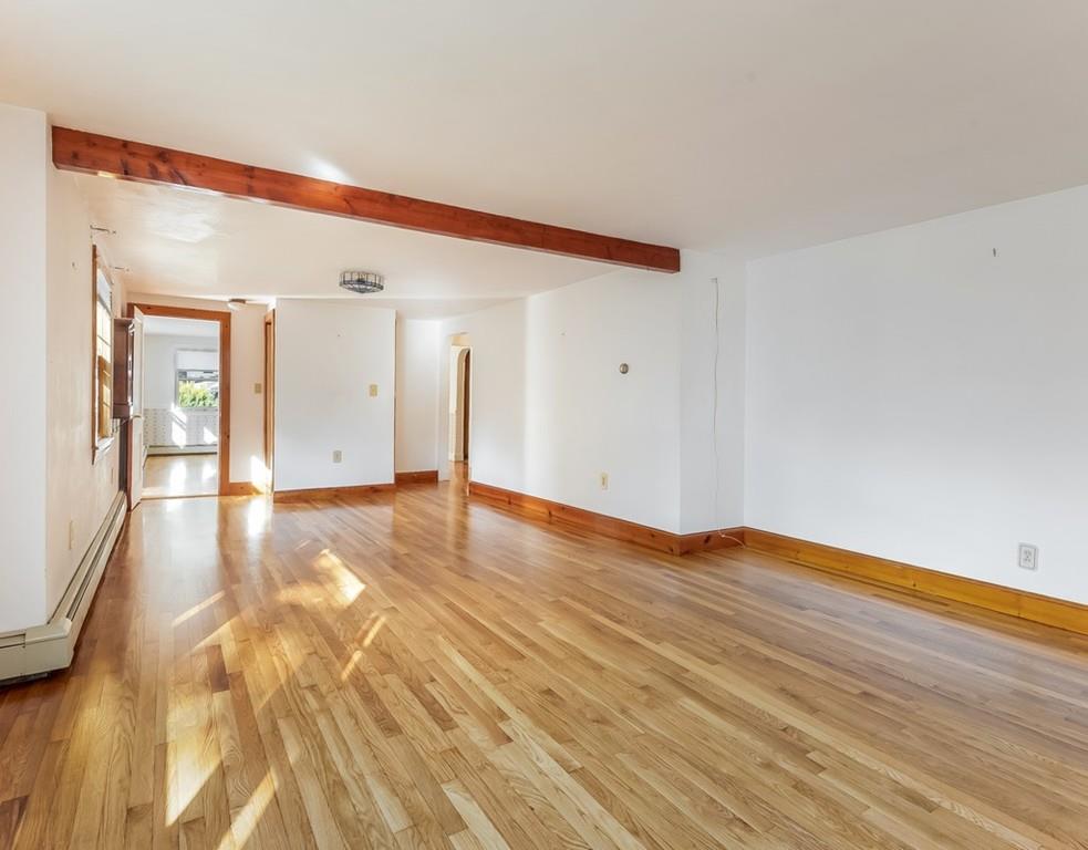 17 Nashoba Road Acton, MA 01720 - Photo 3 of 26 a view of an empty room and wooden floor