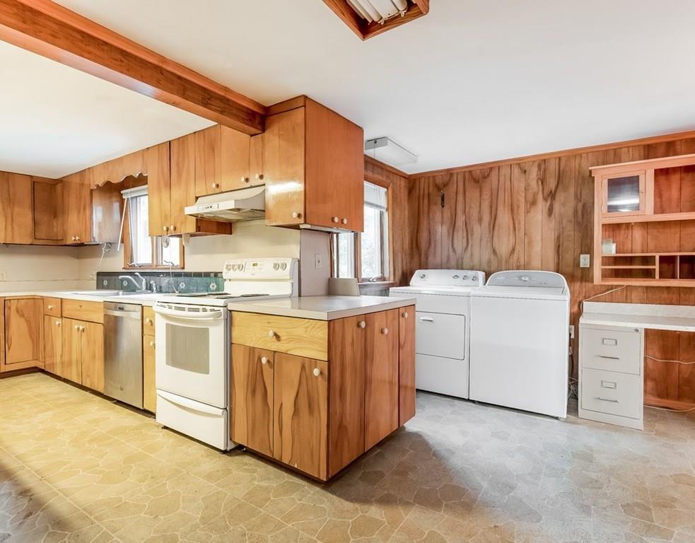 17 Nashoba Road Acton, MA 01720 - Photo 7 of 26 a kitchen with white cabinets sink and white appliances