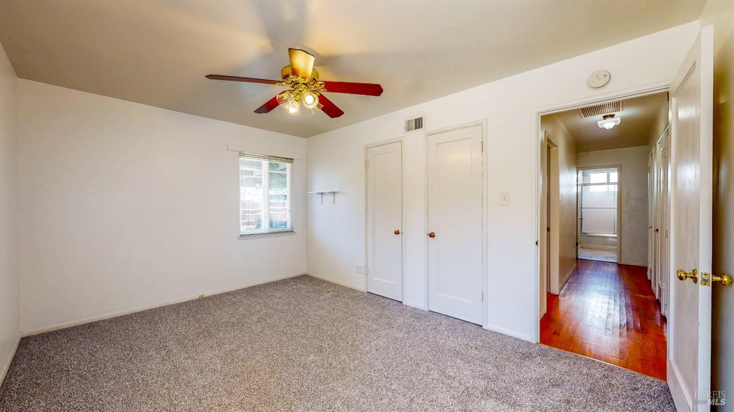 809 Maple Avenue Vallejo, CA 94591 - Photo 26 of 46 wooden floor in an empty room with a window