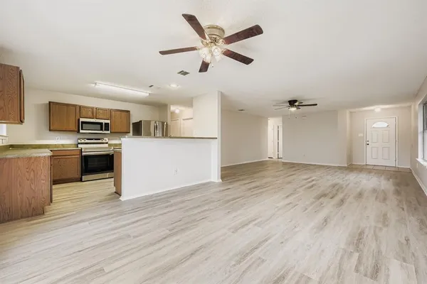 a view of a kitchen with a sink and a stove