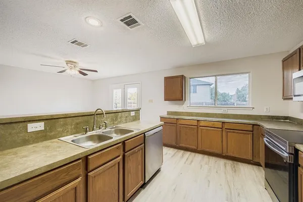 a bathroom with a granite countertop sink mirror and double