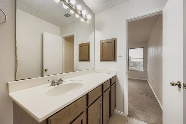 a view of room with racks on the wall