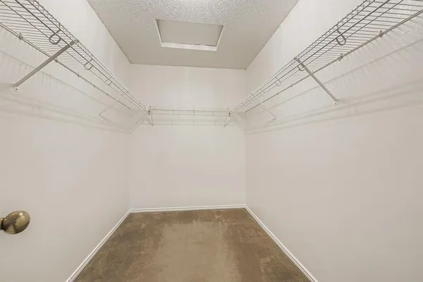 a view of a room with racks on the wall