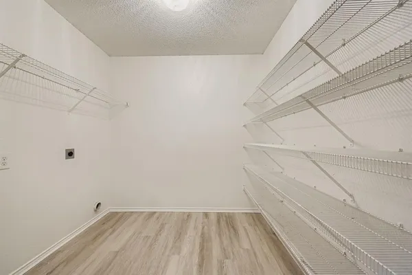 a view of room with racks on the wall