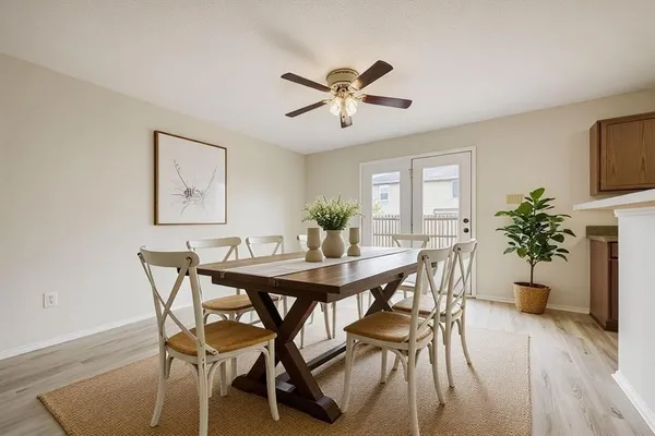 a view of a dining room with furniture and window