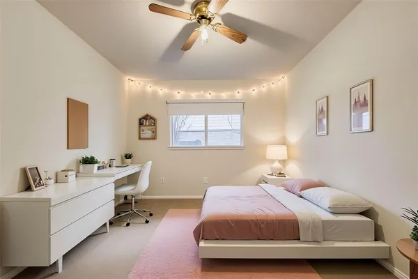 a bedroom with a bed and a table