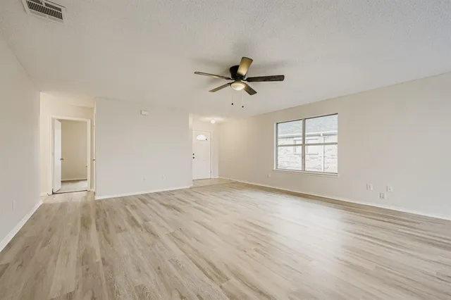 a view of a kitchen with a dishwasher cabinets and wooden floor